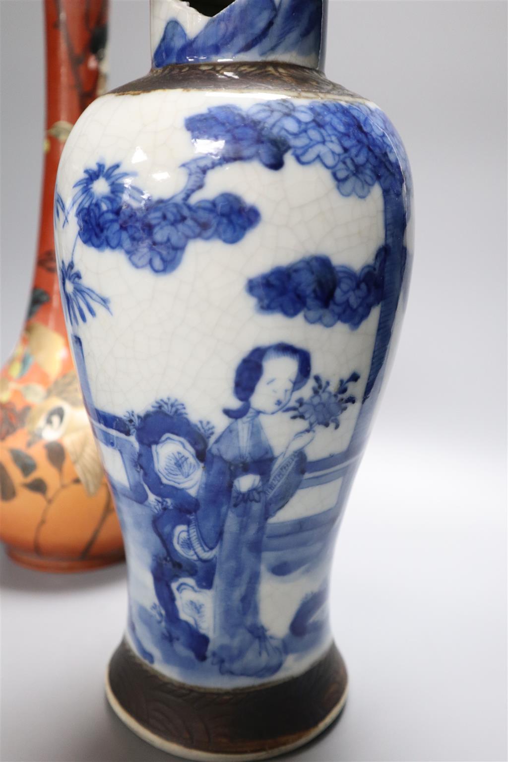 A Satsuma vase, 34cm, and two Chinese blue and white porcelain baluster jars and covers, all late 19th/early 20th century